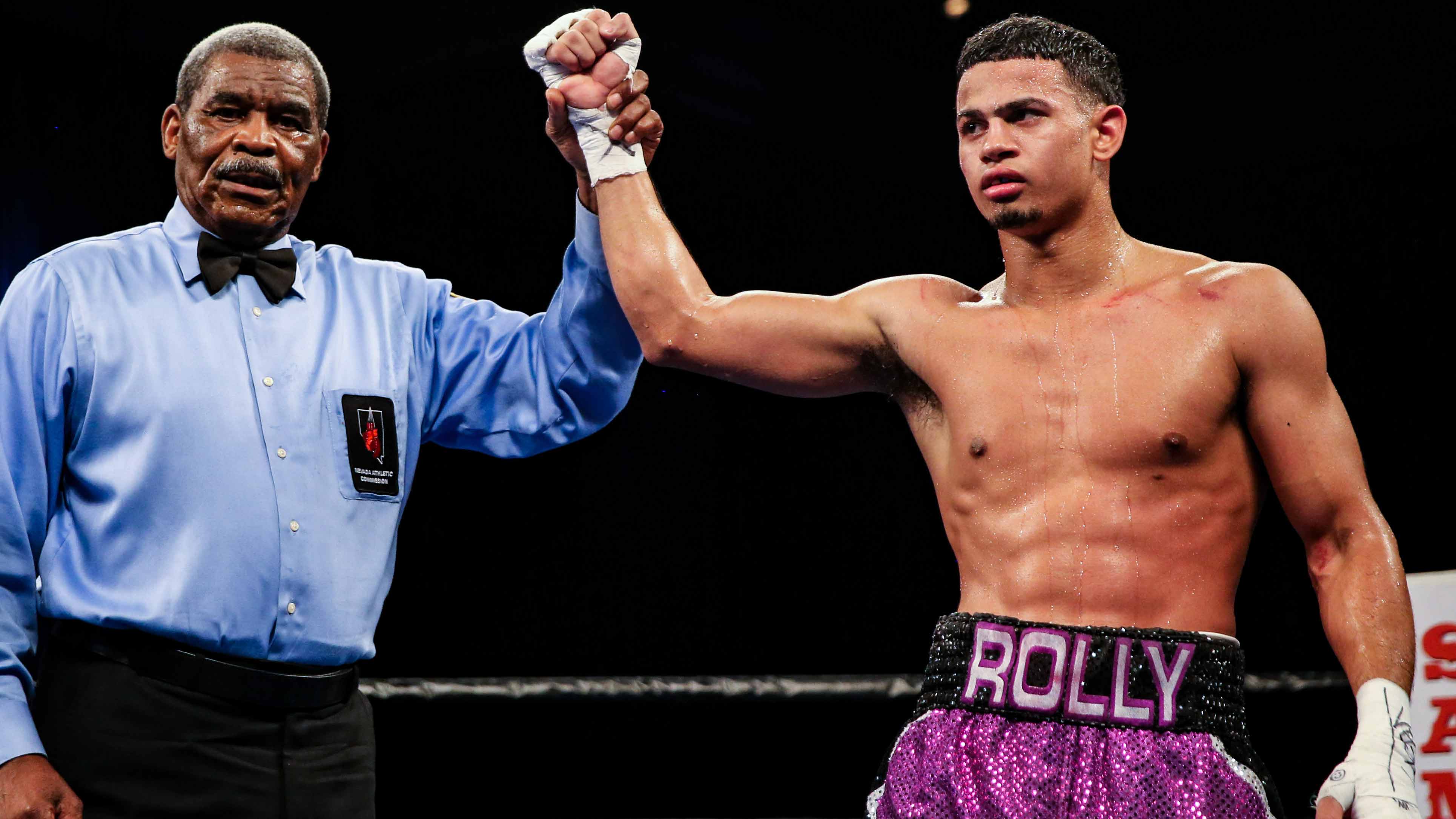 Photo: rolly romero boxing record